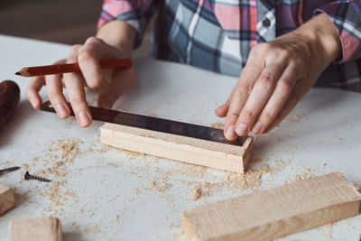 Midsection of person preparing food on table