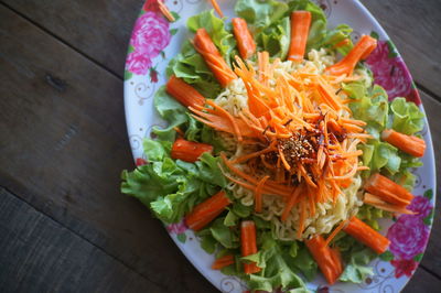 High angle view of chopped vegetables in plate on table