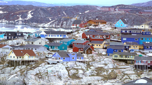 View of houses in town during winter