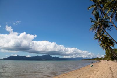 Aborigine woman praying on this beach infested by crocodiles