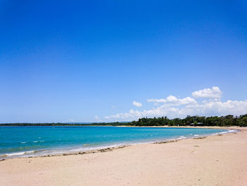 View of beach against blue sky