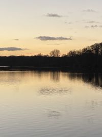 Scenic view of lake against sky during sunset