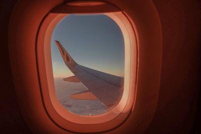 Airplane wing seen through window