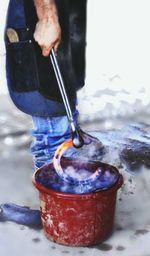 Close-up of man working in water