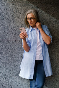 Young woman using mobile phone