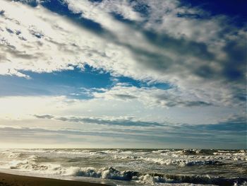 Scenic view of sea against cloudy sky