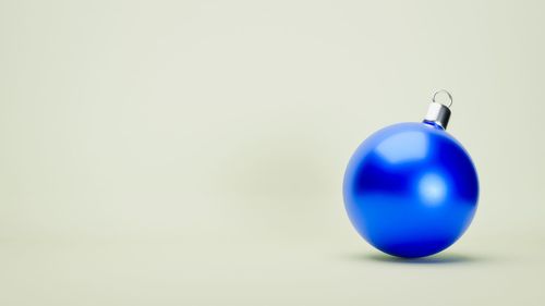 Close-up of blue ball on white background