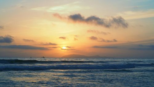 Scenic view of sea at sunset
