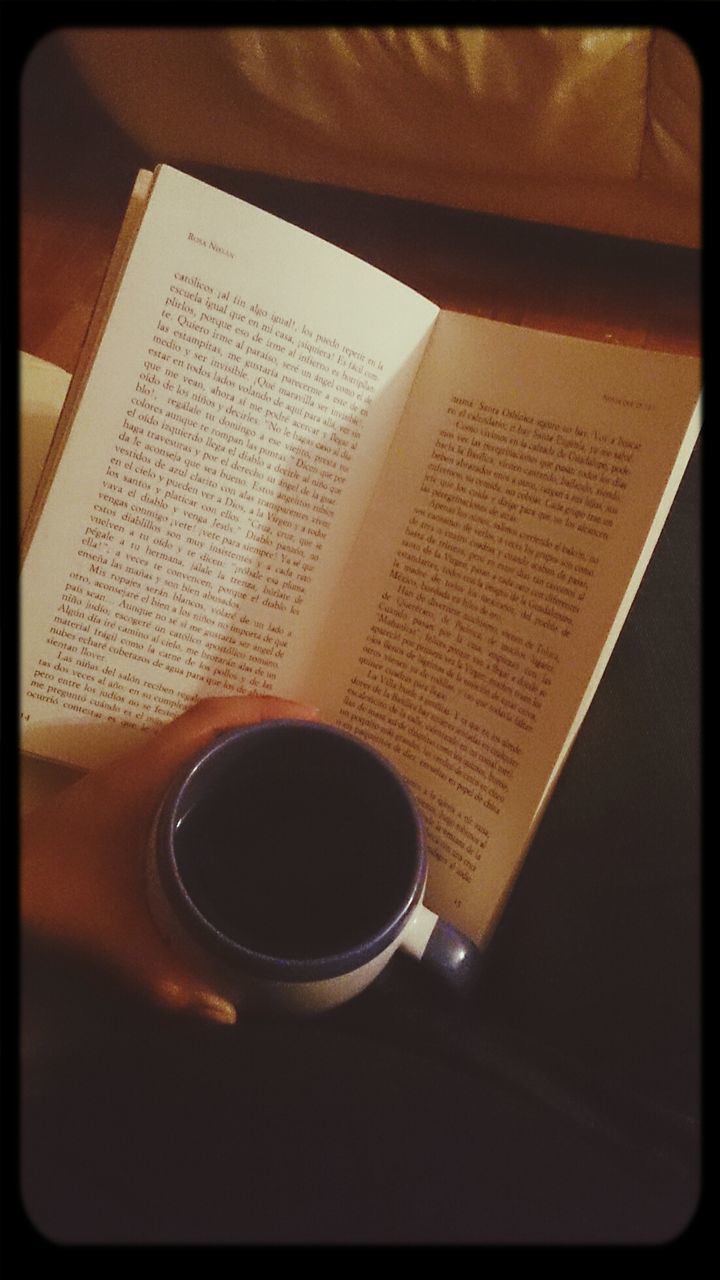 indoors, transfer print, coffee cup, drink, table, refreshment, food and drink, coffee, auto post production filter, coffee - drink, cup, still life, close-up, saucer, high angle view, freshness, no people, spoon, tea cup, tea