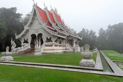 Statue of temple against sky