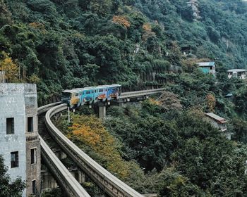 High angle view of railroad tracks by mountain