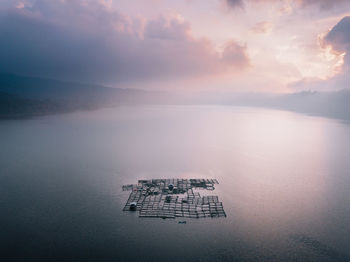 High angle view of floating on sea against sky