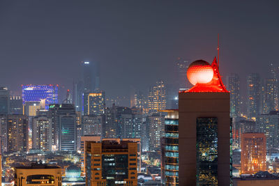 Illuminated buildings in city at night