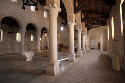 Illuminated corridor of cathedral