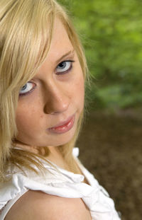 Close-up portrait of a smiling young woman