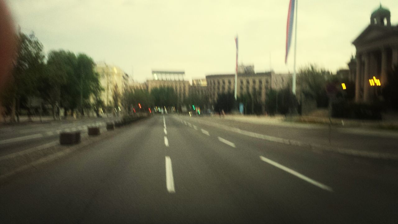 transportation, road, the way forward, road marking, street, built structure, architecture, building exterior, diminishing perspective, street light, sky, city, vanishing point, car, fog, dusk, illuminated, mode of transport, travel, outdoors