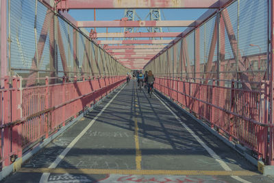 People walking on footbridge