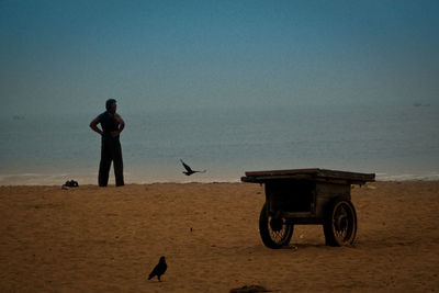 Children flying in sand