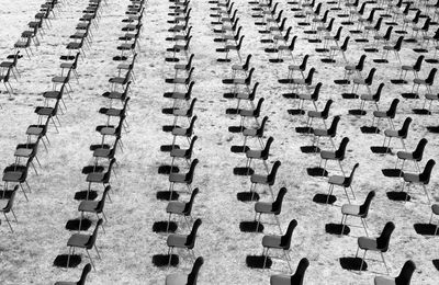 Top view of a series of chairs in a row inside the roman amphitheater of sutri 