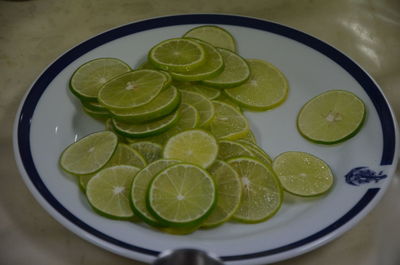 High angle view of fruits in plate on table