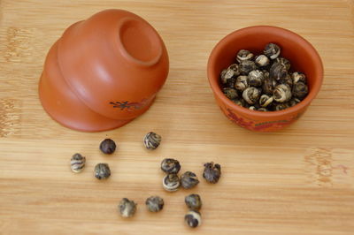 High angle view of jasmin green tea in bowl on table