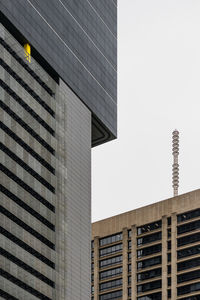 Low angle view of modern buildings against clear sky