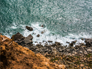 High angle view of rocks in sea