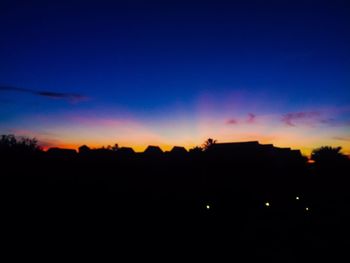 Silhouette landscape against sky during sunset