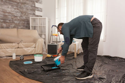 Man working on floor at home