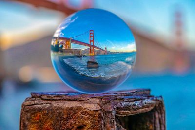 Digital composite image of sea against blue sky