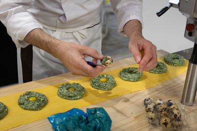Preparation of ravioli italian pasta with spinach and quail eggs.