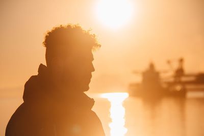 Portrait of silhouette man against sky during sunset