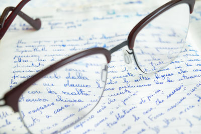 Close-up of eyeglasses on paper