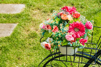 High angle view of rose bouquet on field