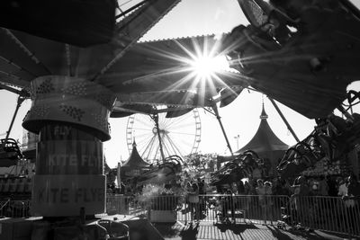 Low angle view of amusement park ride against sky