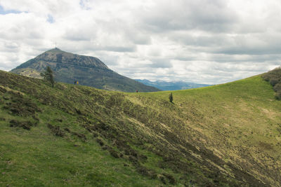 Scenic view of puy de dome and puy pariou, a volcanic landscape against sky