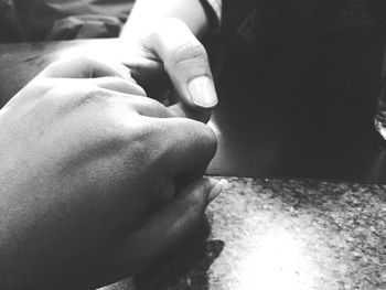 Close-up of couple holding hands