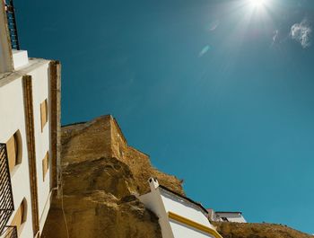 Low angle view of built structure against blue sky