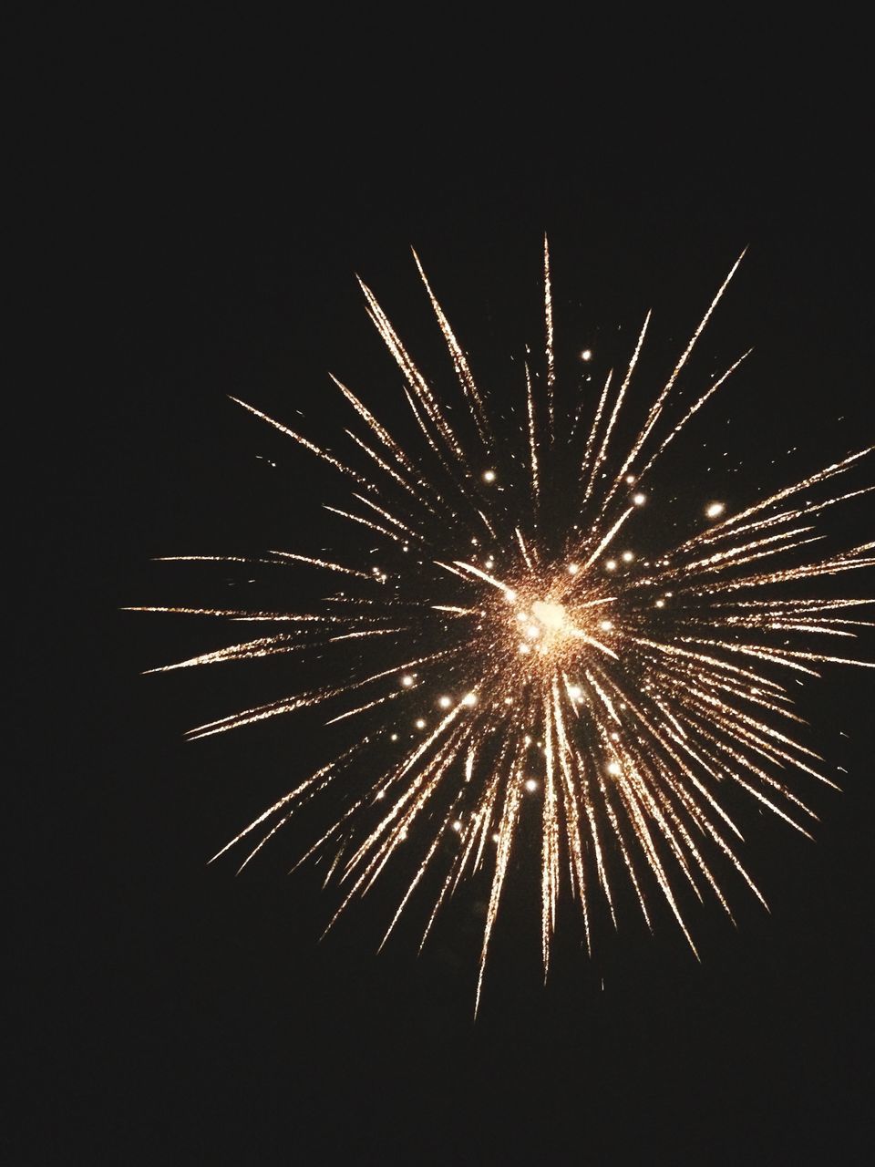 celebration, firework display, exploding, firework - man made object, event, night, arts culture and entertainment, long exposure, glowing, low angle view, motion, outdoors, sparks, no people, smoke - physical structure, illuminated, blurred motion, sky, celebration event, firework