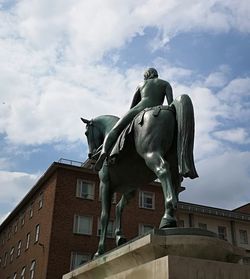 Low angle view of statue against sky