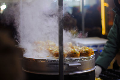 Close-up of preparing food at market stall