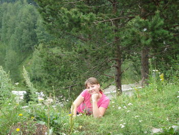 Portrait of teenage girl sitting on grass