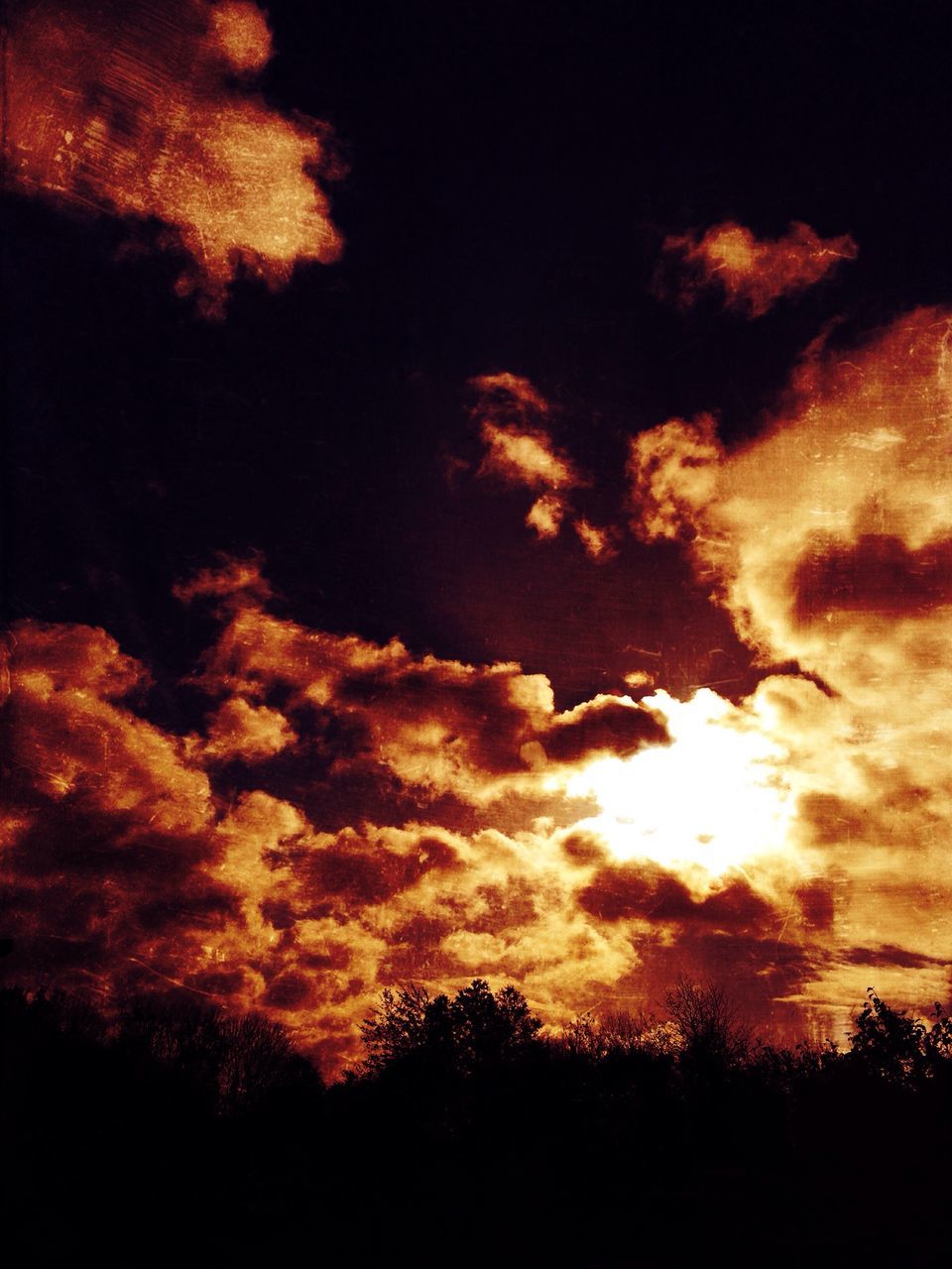 sunset, silhouette, sky, beauty in nature, scenics, cloud - sky, tranquility, tranquil scene, orange color, dramatic sky, nature, idyllic, cloudy, low angle view, cloud, tree, dark, majestic, atmospheric mood, outdoors