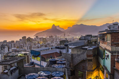 Cityscape against sky during sunset