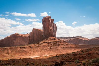 View of rocky mountain against cloudy sky