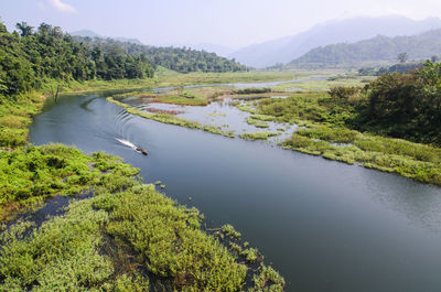 High angle view of river amidst agricultural landscape