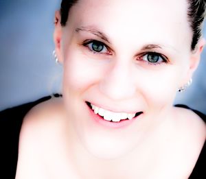 Close-up portrait of a smiling young woman