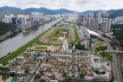 High angle view of city street and buildings against sky