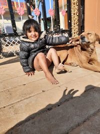 Portrait of boy with dog