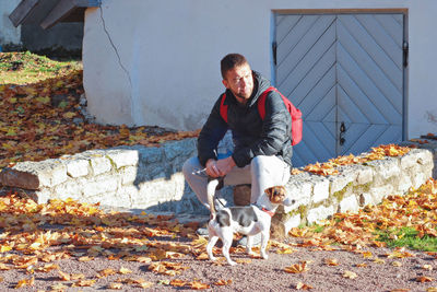 Full length of man with dog